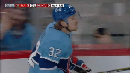 Hockey Player in Blue Jersey Number 32
