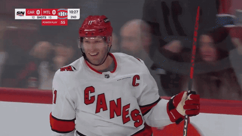 Hockey Player In Canes Jersey Smiling GIF