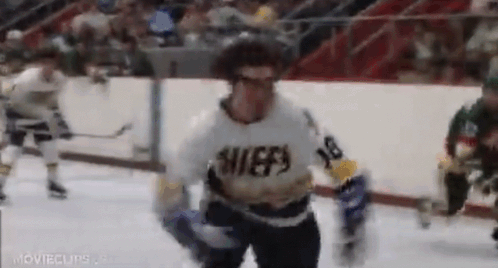 Hockey Player in Chiefs Jersey Running on Ice