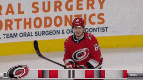 Hockey Player in Front of Oral Surgery Ad