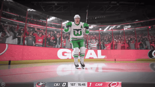 Hockey Player in Green and White with Letter W