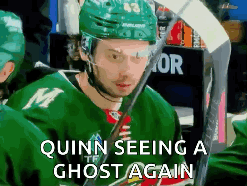 Hockey Player in Green Jersey Saying Quinn Sees Ghost