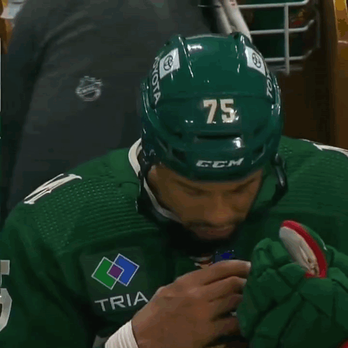 Hockey Player in Green Jersey With M