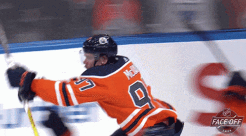 Hockey Player In Orange Jersey Number 9 GIF