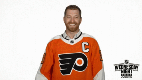 Hockey Player in Orange Jersey with C