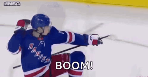 Hockey Player in Rangers Jersey Pointing