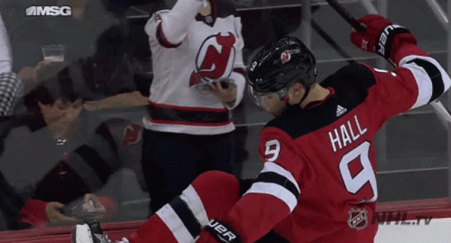 Hockey Player In Red And Black Uniform Hall GIF