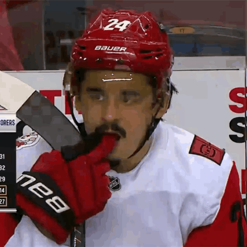 Hockey Player in Red Helmet Number 24