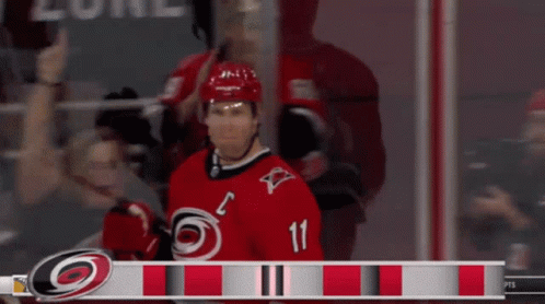 Hockey Player in Red Jersey Number 11
