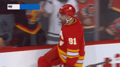 Hockey Player in Red Jersey Number 91