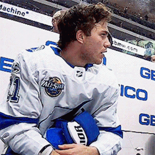 Hockey Player in White and Blue Uniform