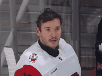 Hockey Player in White Jersey Saying Russian