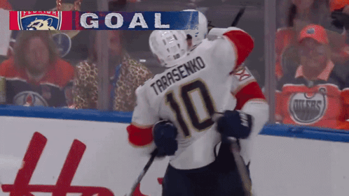 Hockey Player Number 10 Hugging Teammate