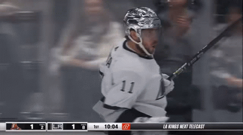 Hockey Player Number 11 Holding Stick