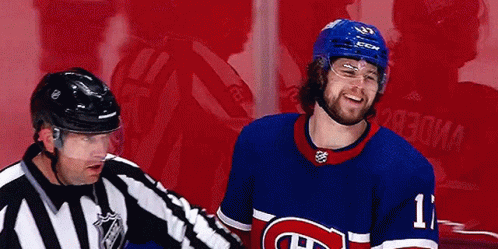 Hockey Player Number 11 Talking to Referee
