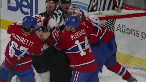 Hockey Player Number 14 Fighting Another Player