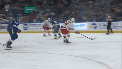 Hockey Player Number 14 Holding Stick