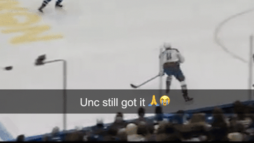 Hockey Player Number 14 Standing on Ice