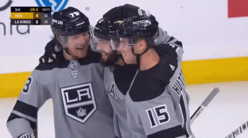 Hockey Player Number 15 Hugging Another Player