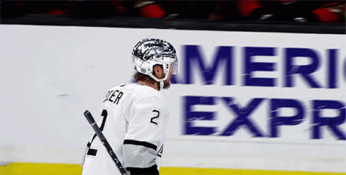 Hockey Player Number 2 with American Express Sign