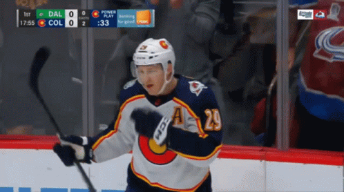 Hockey Player Number 20 Holding Stick