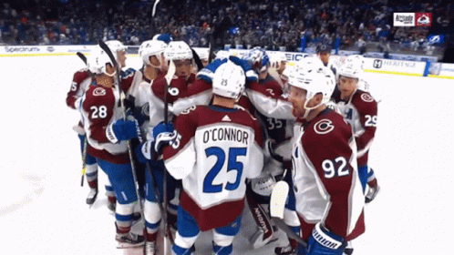 Hockey Player Number 25 Surrounded