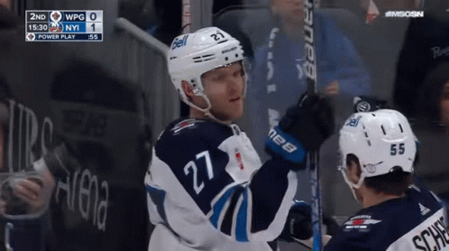 Hockey Player Number 27 Holding Stick
