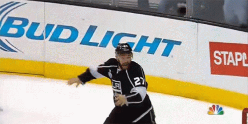 Hockey Player Number 27 Skating on Ice