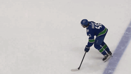 Hockey Player Number 28 Skating on Ice