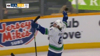 Hockey Player Number 4 Holding Stick