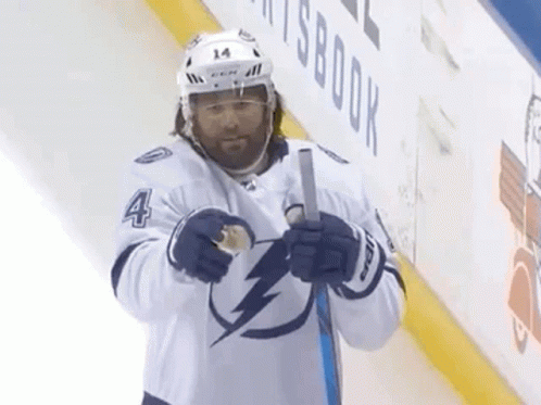 Hockey Player Number 4 Holding Stick