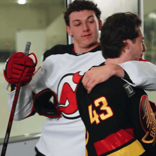 Hockey Player Number 43 Hugging