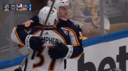 Hockey Player Number 57 Hugging Teammate