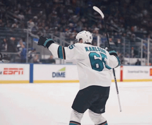 Hockey Player Number 6 Holding Stick
