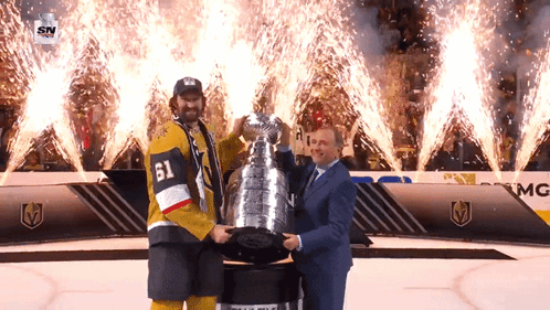 Hockey Player Number 61 Holding Trophy