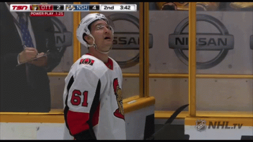 Hockey Player Number 61 In Front Of Nissan Logo GIF