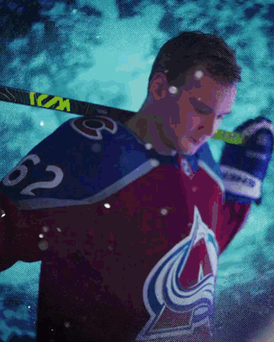 Hockey Player Number 62 Holding Stick