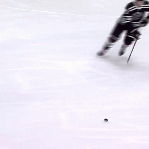 Hockey Player Number 72 Holding Puck