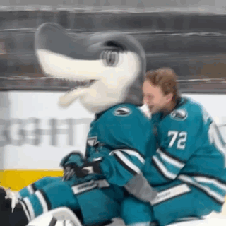 Hockey Player Number 72 Hugs Mascot GIF