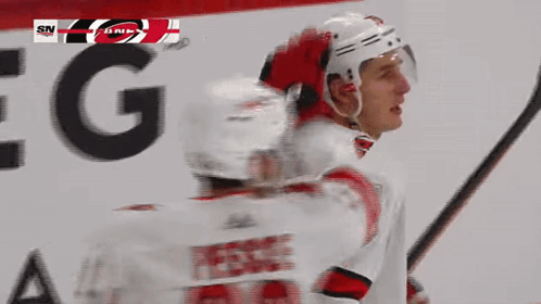 Hockey Player Number 76 Holding Stick