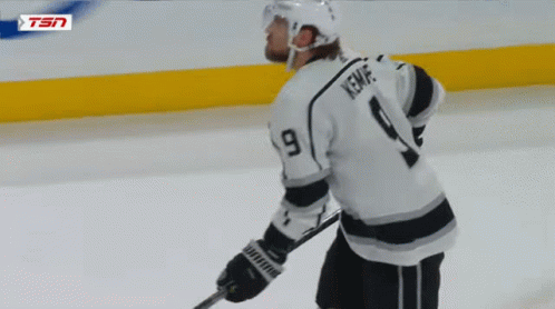 Hockey Player Number 9 Kneeling on Ice