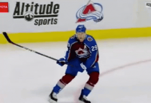 Hockey Player on Ice in Front of Altitude Sports