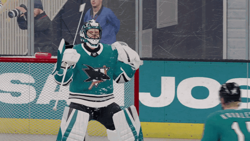 Hockey Player On Ice In Front Of Joe's Advertisement GIF