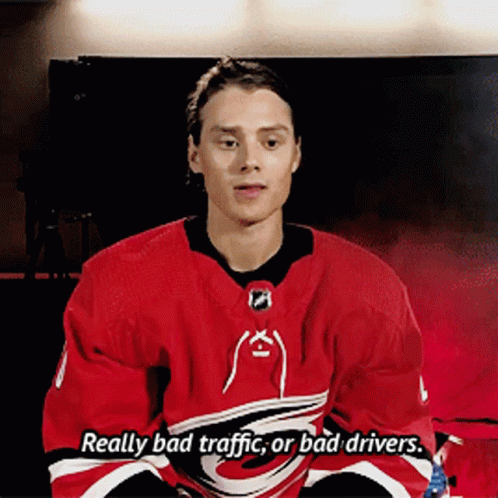 Hockey Player Red Jersey Saying Really Bad Traffic