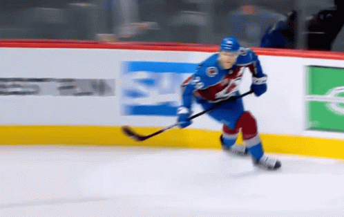 Hockey Player Skating On Ice GIF