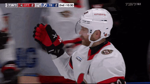 Hockey Player Smiling with A on Jersey
