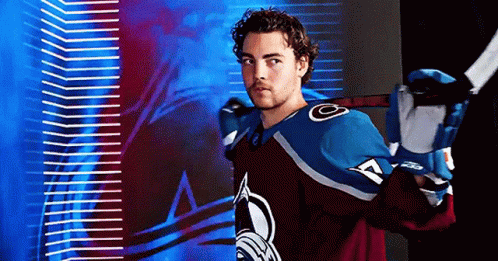 Hockey Player Smiling with Stick