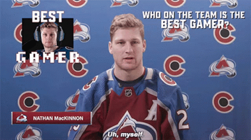 Hockey Player Standing Next to Bauer Stick