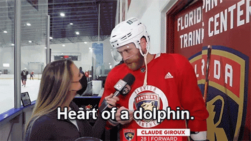 Hockey Player Talking to Woman Saying Heart of a Dolphin