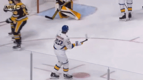 Hockey Player Thompson Holding Puck GIF